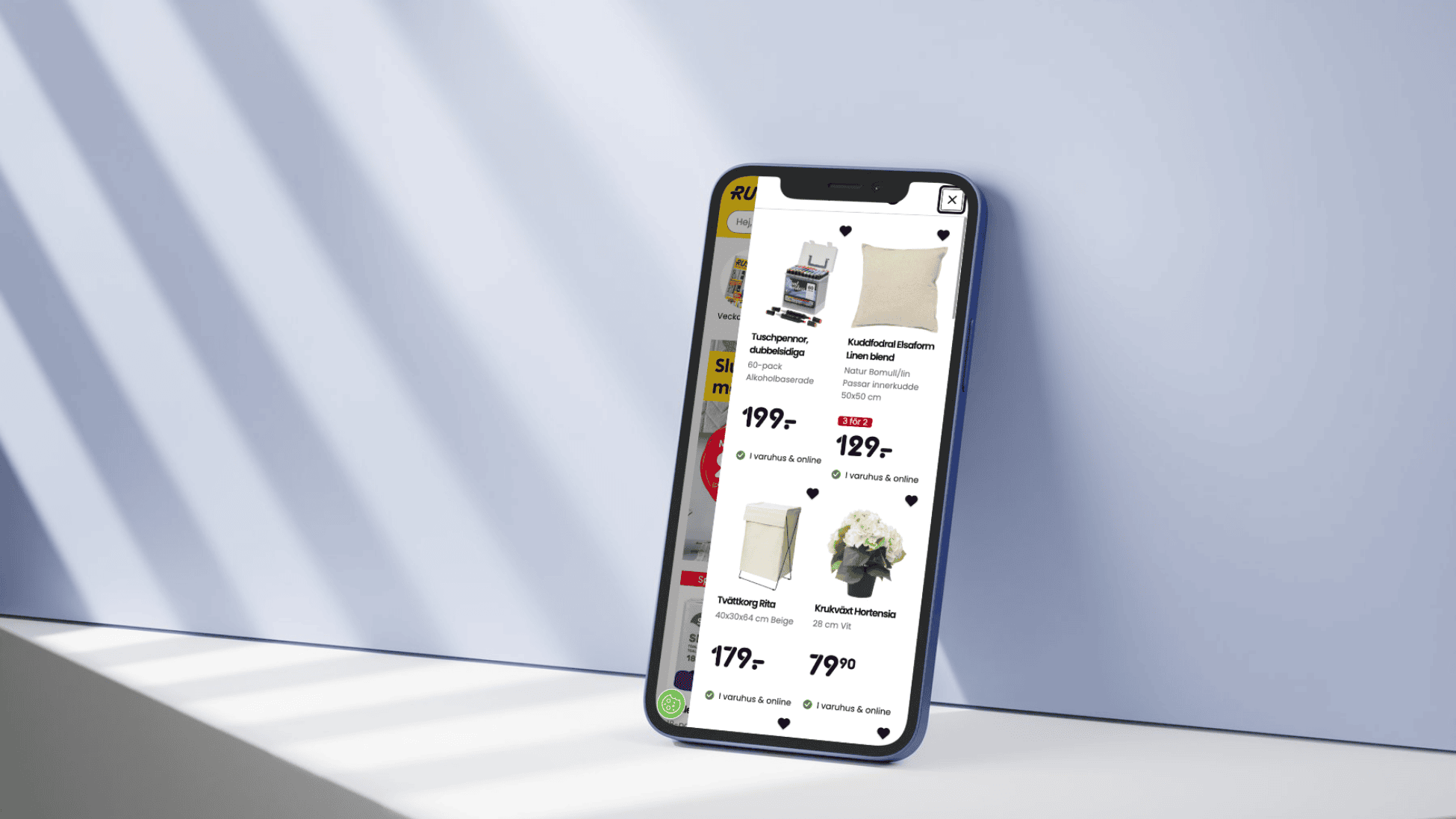 Rusta website from a mobile device leaned on a wall